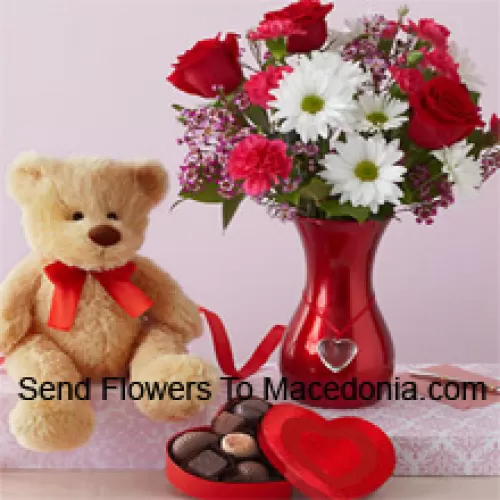 Red Roses And White Gerberas With Some Ferns In A Glass Vase Along With A Cute 12 Inches Tall Brown Teddy Bear And An Imported Box Of Chooclates